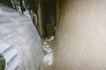 34.2 Bags of hard concrete I can use to barricade the door & more bear damage at bottom.jpg
